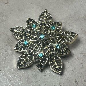 Gold tone flower aqua stones brooch
